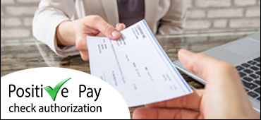 Positive Pay check authorization verbiage with image showing people handing checks to one another
